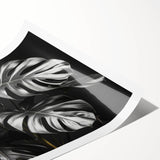 Botanical wall art print featuring a vibrant monstera leaf design in shades of green, elegantly rolled for easy framing and display, perfect for adding a tropical touch to home decor.