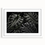 Botanical wall art collection featuring a Monstera design with a white frame and mat, showcasing vibrant green leaves against a clean background, perfect for home decor.