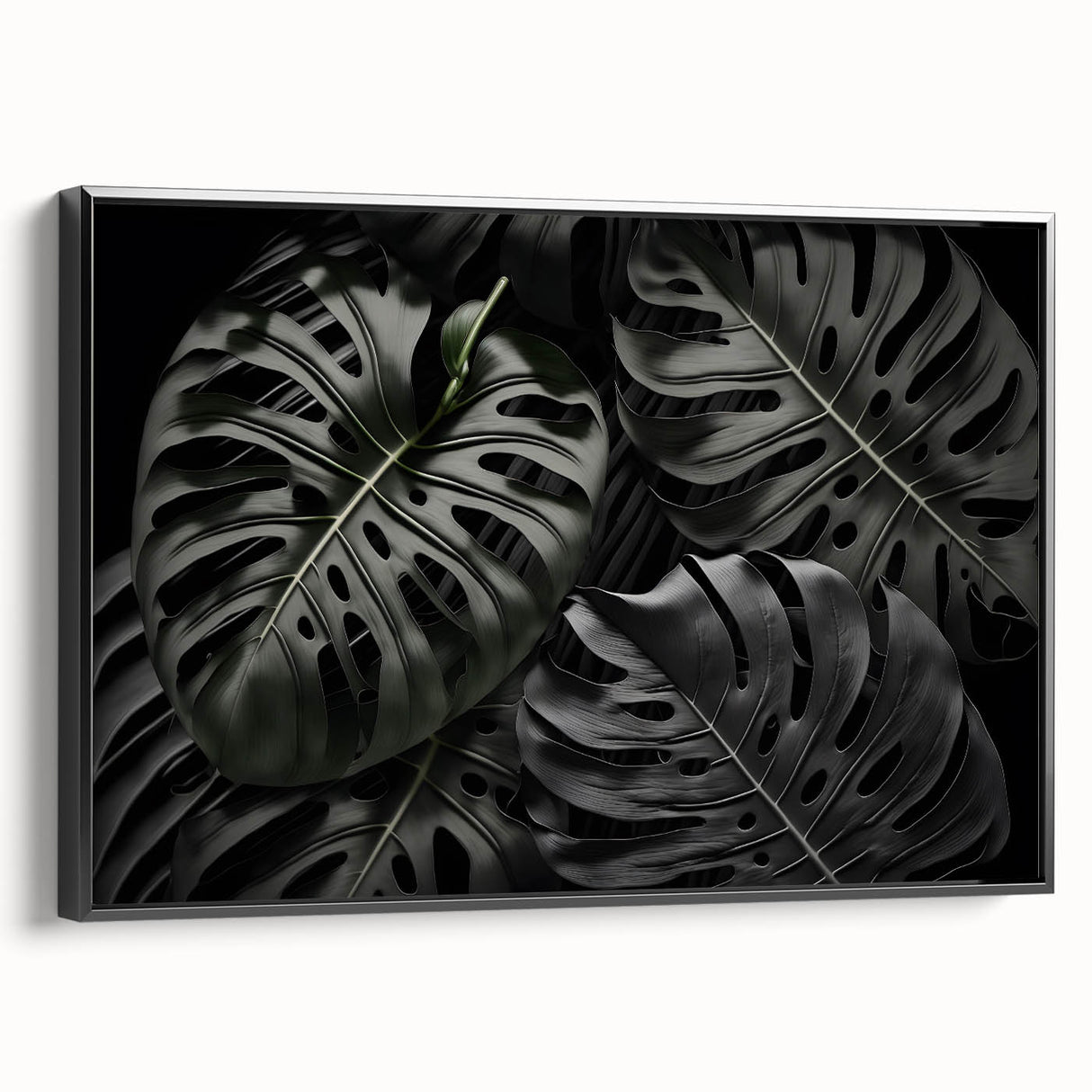 Framed canvas wall art featuring a botanical monstera design in vibrant green and black tones, showcasing tropical leaves against a minimalist background, perfect for modern decor.