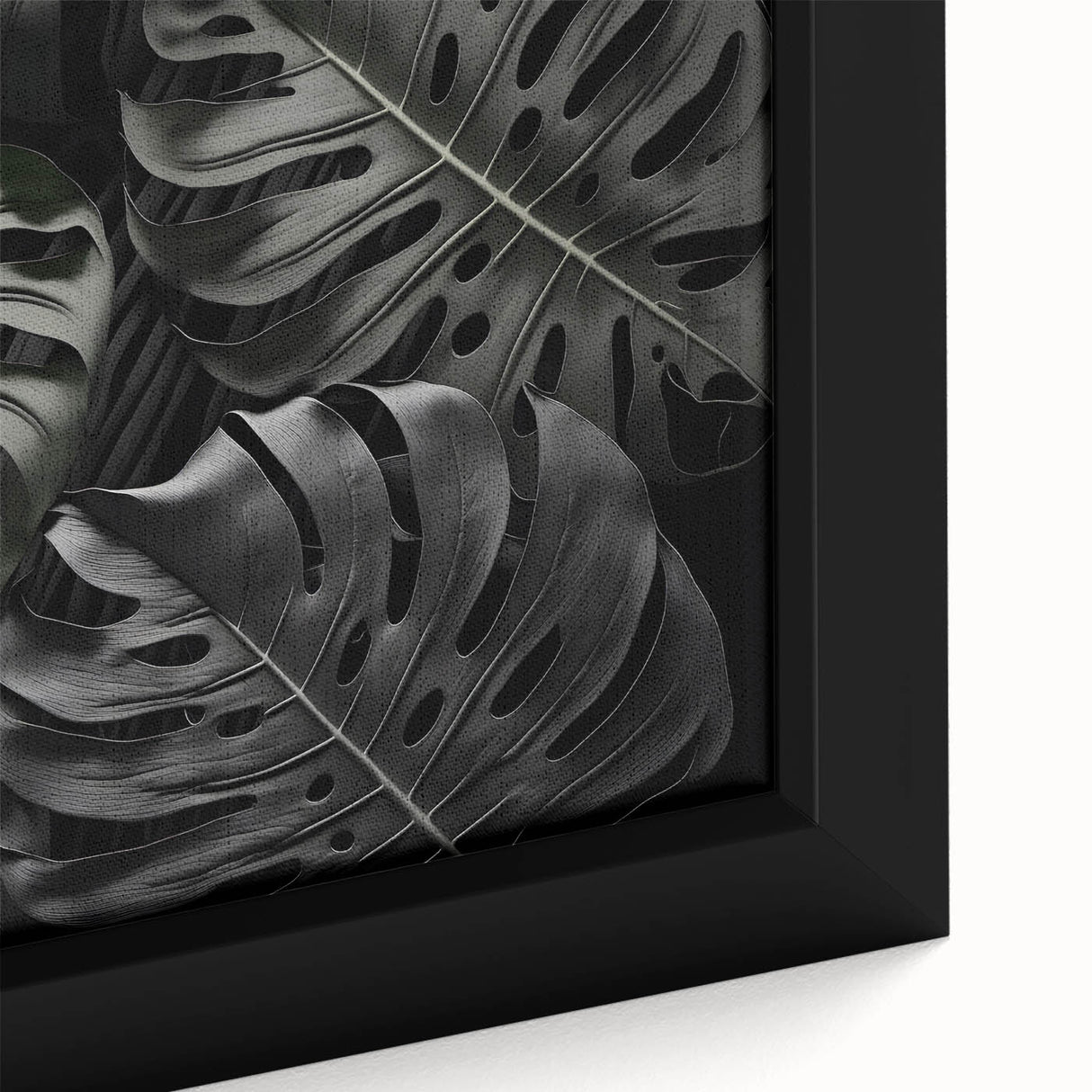 Close-up of a framed canvas wall art featuring a vibrant monstera leaf design, showcasing rich greens and botanical details, perfect for home decor enthusiasts.