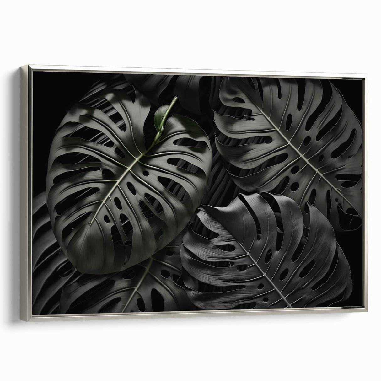 Framed wall art featuring a botanical monstera design, showcasing vibrant green leaves against a silver background, ideal for modern home decor.