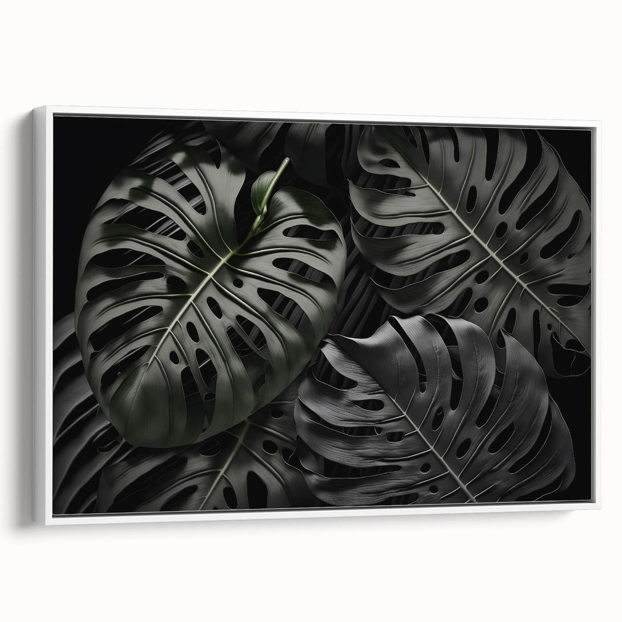 Framed canvas wall art featuring a botanical monstera leaf design against a white background, showcasing vibrant green hues and intricate details, perfect for home decor.
