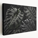 Stretched canvas wall art featuring a vibrant botanical Monstera design, showcasing lush green leaves against a neutral background, perfect for modern home decor.