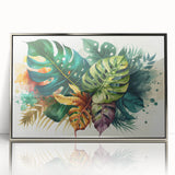 Framed wall art featuring a vibrant botanical design of a monstera leaf, showcasing rich green tones against a sleek silver frame, ideal for modern decor.