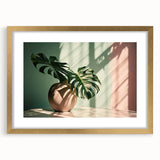 Botanical wall art print featuring a vibrant Monstera leaf design, elegantly framed with a gold mat, perfect for modern home decor. Ideal for plant lovers.