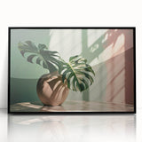 Framed wall art featuring a botanical Monstera design, showcasing vibrant green leaves against a black background, ideal for modern home decor.