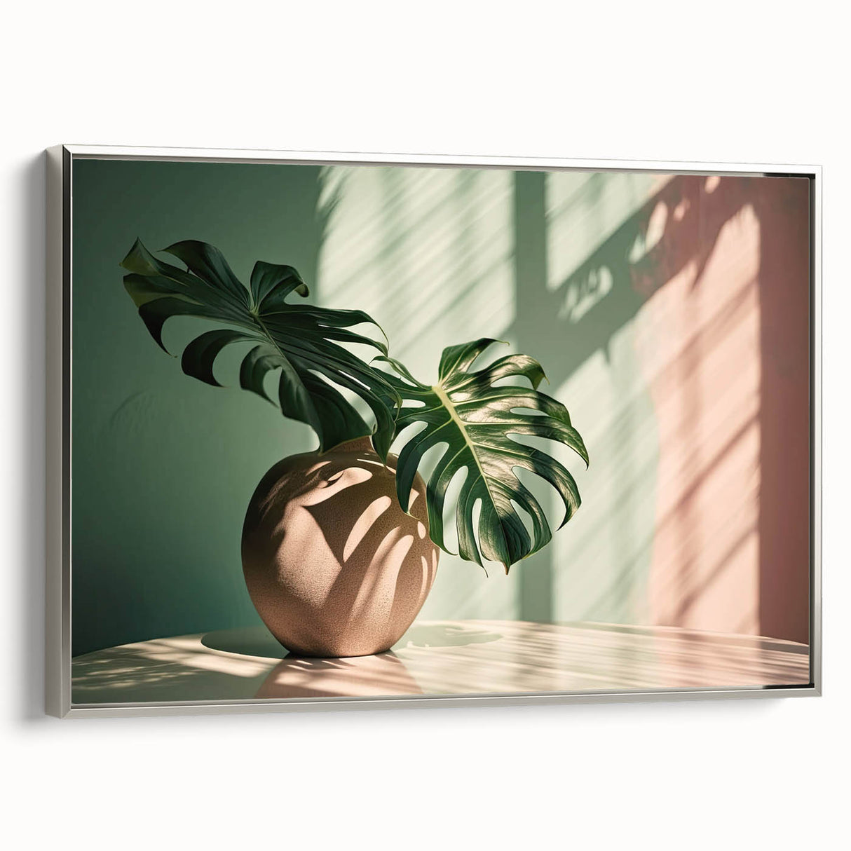 Framed canvas wall art featuring a botanical monstera design with vibrant green leaves on a silver background, perfect for modern home decor. The artwork adds a touch of nature and elegance to any room, enhancing the aesthetic appeal of the space.