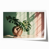 Botanical art print featuring a vibrant monstera leaf design on a textured background, rolled and ready for display, ideal for home decor enthusiasts.