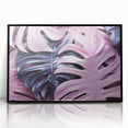 Framed wall art showcasing a vibrant monstera leaf design in a black acrylic frame. Perfect for adding a touch of nature to modern home decor, this botanical print enhances any living space.