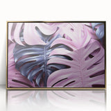 Framed wall art featuring a botanical monstera design, with vibrant green leaves and a sleek gold frame, perfect for modern home decor.