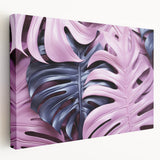 Stretched canvas wall art showcasing a vibrant Monstera leaf design, perfect for botanical-themed decor, displayed in a side view to highlight its texture and colors.