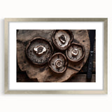 Botanical wall art featuring an intricate design of colorful flowers and mushrooms, elegantly framed with a silver mat, perfect for enhancing home decor.