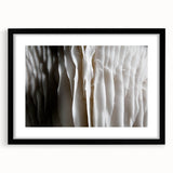 Black-framed wall art featuring a botanical design of colorful flowers and mushrooms, showcasing intricate details and vibrant colors, perfect for home decor.