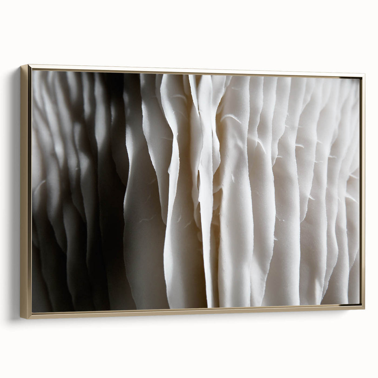 Framed wall art featuring a botanical design of colorful flowers and mushrooms on a textured canvas, elegantly displayed with a gold frame, enhancing home decor.