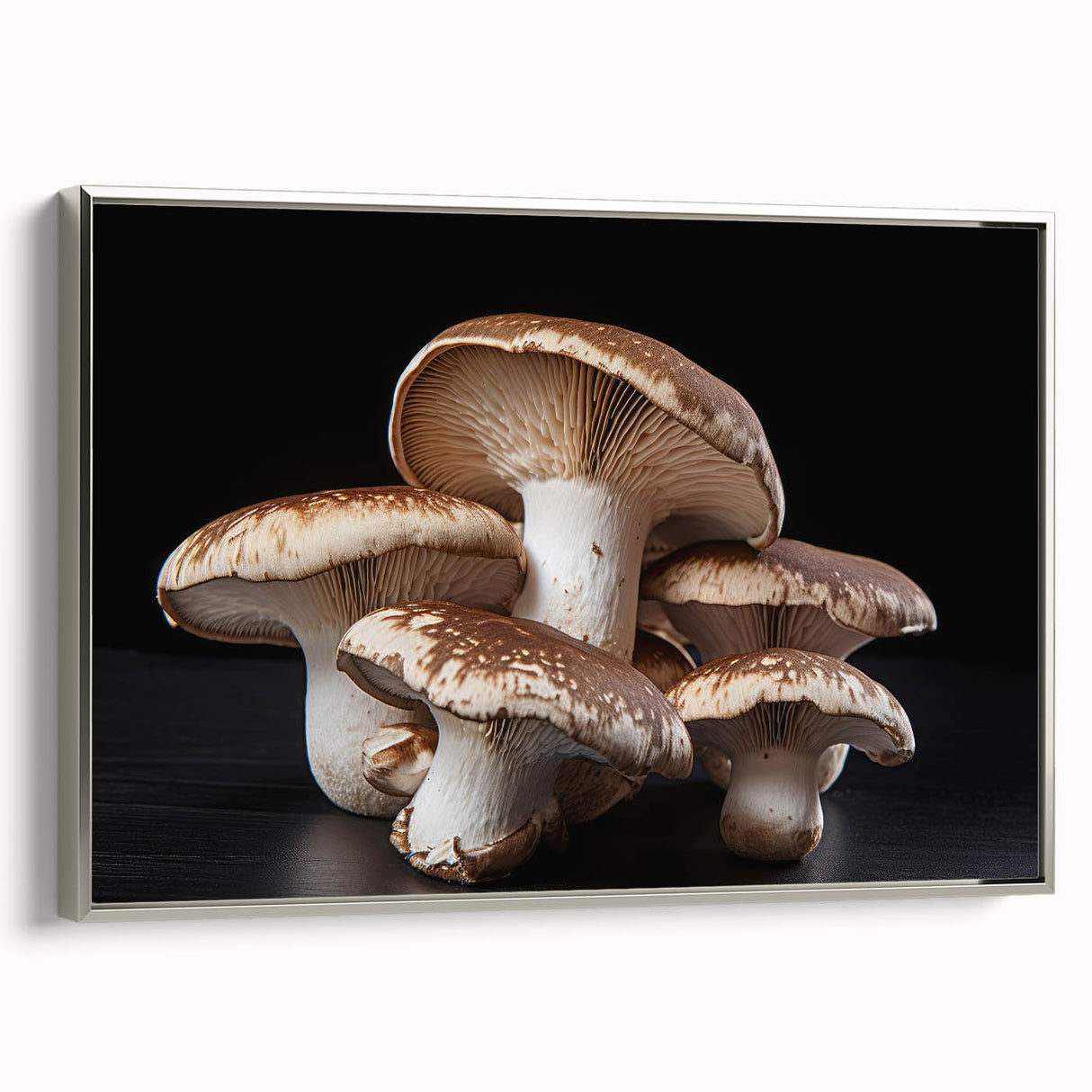 Framed wall art featuring a botanical design of vibrant mushrooms on canvas, elegantly displayed with a silver frame, perfect for enhancing modern home decor.