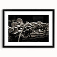 Botanical wall art featuring an elegant design of colorful flowers and mushrooms, framed in a sleek black frame with a mat, perfect for home decor.