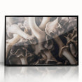 Framed wall art showcasing a botanical design of colorful flowers and mushrooms, with a sleek black frame, perfect for adding a touch of nature-inspired decor to any room.