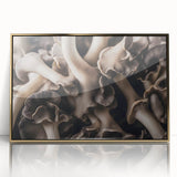 Framed wall art featuring a botanical design of colorful flowers and mushrooms, encased in an elegant gold frame, ideal for enhancing home decor aesthetics.