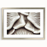 Botanical wall art featuring an elegant arrangement of flowers and mushrooms, framed in silver with a mat, perfect for enhancing home decor.