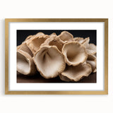 Elegant wall art featuring a botanical design of colorful flowers and mushrooms, framed in gold with a mat, showcasing intricate details for home decor.