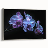 Framed wall art featuring a botanical orchid design on canvas, showcasing vibrant colors and intricate details, with a silver frame enhancing its elegance. Ideal for home decor.