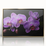 Framed botanical wall art featuring a vibrant orchid design with a gold-acrylic finish, perfect for enhancing home decor or office aesthetics.