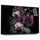 Acrylic wall art displaying a vibrant botanical orchid design, showcasing delicate petals in shades of pink and white, positioned elegantly on a glass surface. Perfect for enhancing home decor with a touch of nature-inspired elegance.