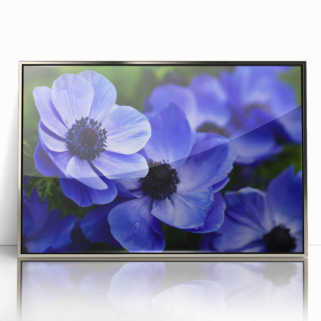 Framed botanical wall art depicting vibrant pansies in shades of purple, yellow, and green, set in a sleek silver frame, perfect for home decor enhancement.