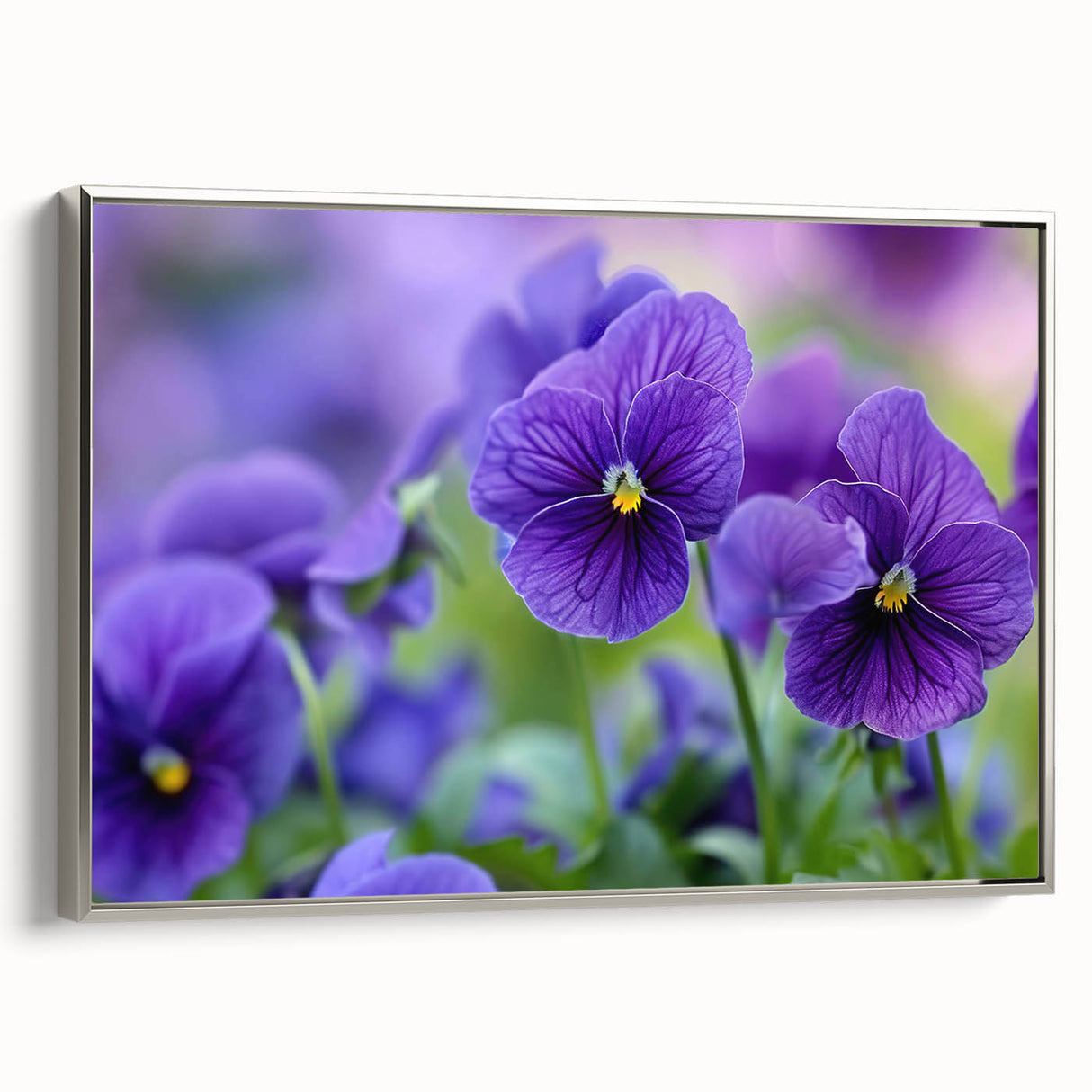Framed botanical wall art featuring a vibrant pansy design in shades of purple and yellow, elegantly presented with a silver frame for a modern touch. Perfect for enhancing home decor.