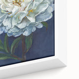 Close-up of a framed botanical wall art piece showcasing vibrant pink peonies on a textured canvas, perfect for home decor or floral enthusiasts.