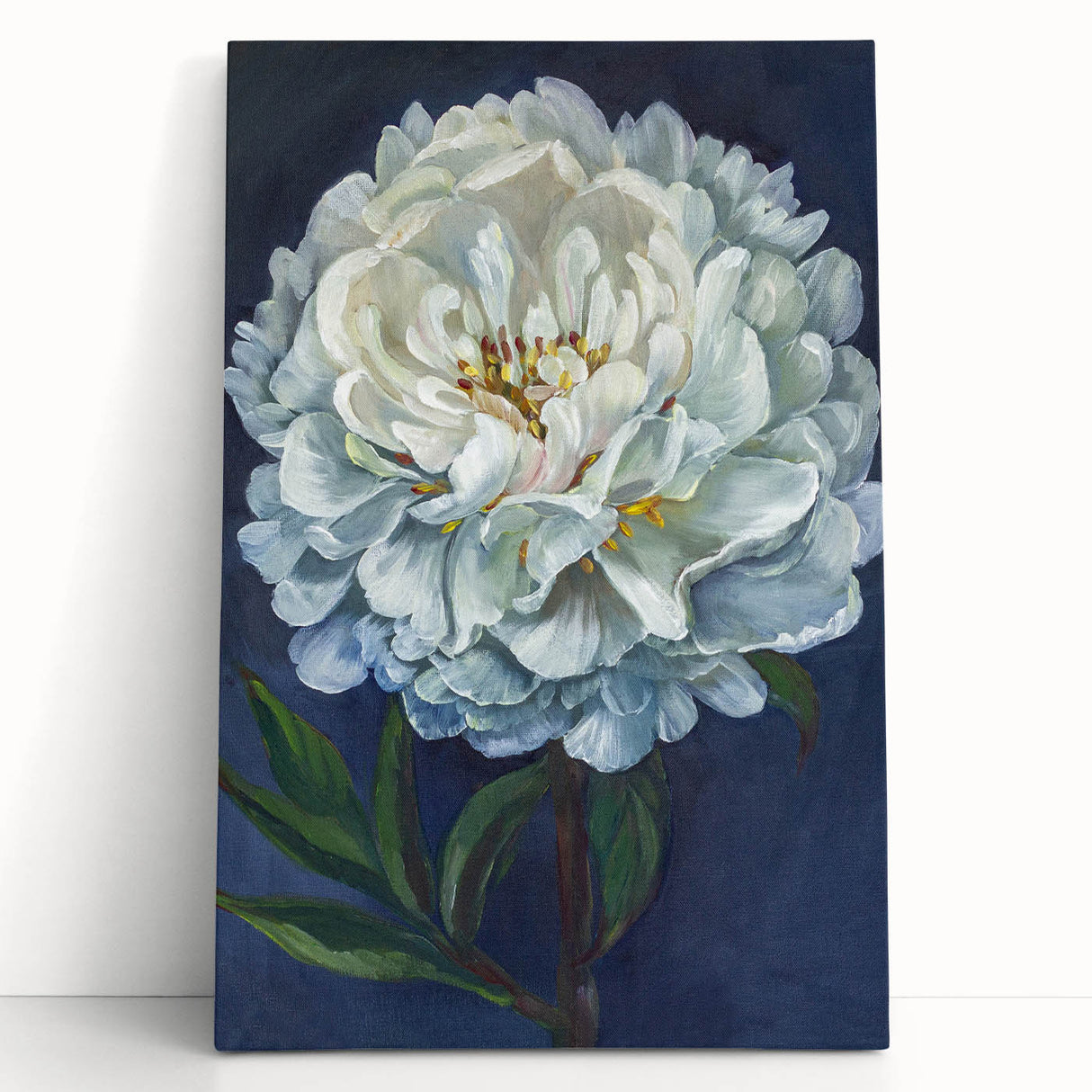 Stretched canvas wall art featuring a vibrant botanical peony design, showcasing lush pink and green hues, elegantly leaning against a white wall for a modern decor touch.