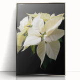 Framed wall art featuring a vibrant botanical design of a poinsettia with intricate details and a silver-acrylic finish, ideal for home decor and holiday aesthetics.