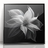 Framed botanical wall art featuring a vibrant poinsettia design on an acrylic surface, showcased in a sleek black frame, perfect for holiday decor.