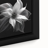 Close-up of a framed canvas featuring a botanical poinsettia design, showcasing vibrant red flowers and lush green leaves, perfect for home decor.