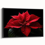 Framed canvas wall art featuring a botanical poinsettia design, showcasing vibrant red and green colors with a sleek black frame, ideal for home decor enhancement.