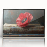 Framed wall art featuring a botanical poppy design in vibrant colors, set in a sleek silver frame, perfect for adding a touch of elegance to home decor.