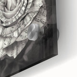 Close-up of a botanical wall art piece featuring a delicate rose design on acrylic glass, showcasing intricate details and vibrant colors ideal for home decor.