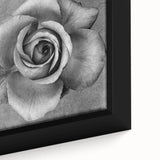 Close-up of a framed botanical wall art piece showcasing vibrant roses with intricate details on a textured canvas, perfect for home decor in any setting.