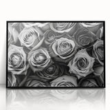 Framed wall art featuring a botanical rose design in vibrant colors, set in a sleek black frame, ideal for home decor or floral-themed interiors.