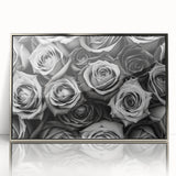 Framed wall art showcasing a botanical rose design in vibrant colors, featuring a sleek silver frame and acrylic front for a modern touch, perfect for home decor.