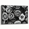 Framed botanical wall art showcasing a detailed rose design on a textured canvas, presented in a sleek black frame, perfect for enhancing modern decor.