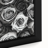 Close-up of a framed botanical rose wall art piece, showcasing intricate details of vibrant pink and white roses against a soft green background, perfect for adding elegance to any room decor.