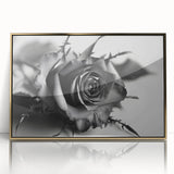 Framed botanical wall art featuring a detailed rose design with a gold-accented acrylic frame, perfect for adding elegance to home decor.