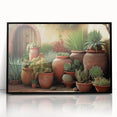 Framed wall art featuring a botanical design of vibrant succulents in an acrylic finish, set against a sleek black frame, perfect for modern decor.