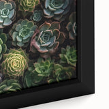Close-up of a framed botanical wall art piece showcasing colorful succulent plants in a modern design, perfect for home decor and interior styling.