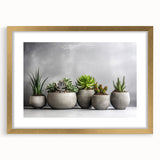 Succulent wall art collection framed in gold, showcasing vibrant botanical designs with a matte finish. Perfect for home decor enthusiasts seeking modern elegance.