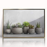 Framed wall art featuring a botanical design of colorful succulents in gold-accented acrylic, ideal for adding a vibrant touch to home decor.