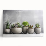 Stretched canvas art showcasing a vibrant botanical design of succulents and colorful flowers, perfect for adding a fresh touch to home decor.