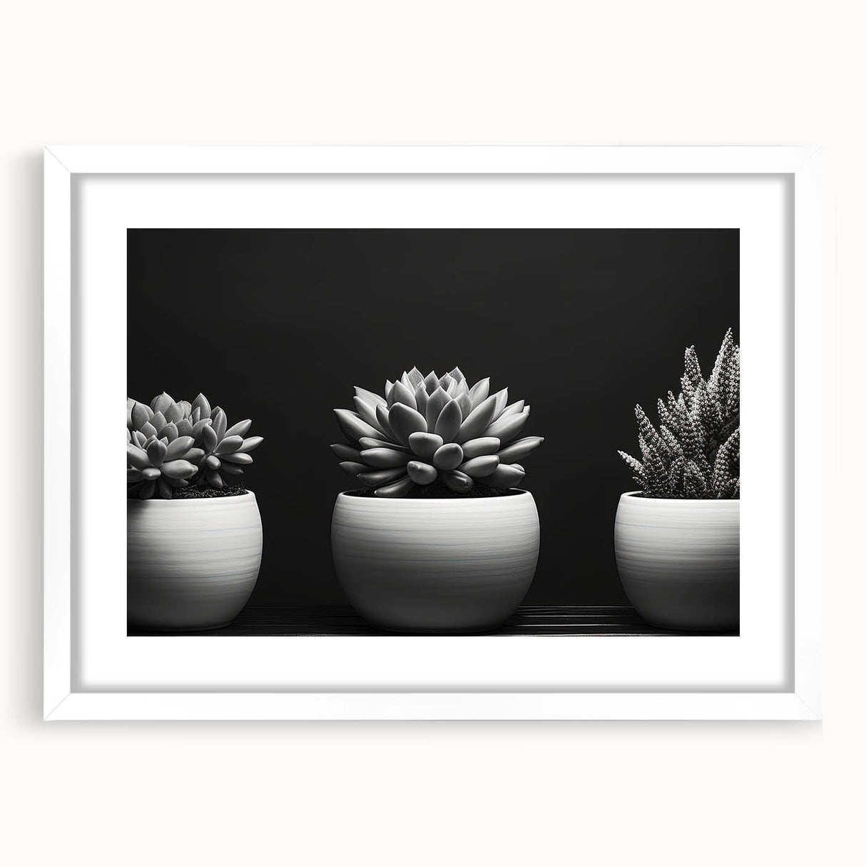 Framed botanical wall art featuring an elegant design of succulents in soft green and pink hues, displayed with a white mat, perfect for modern home decor.