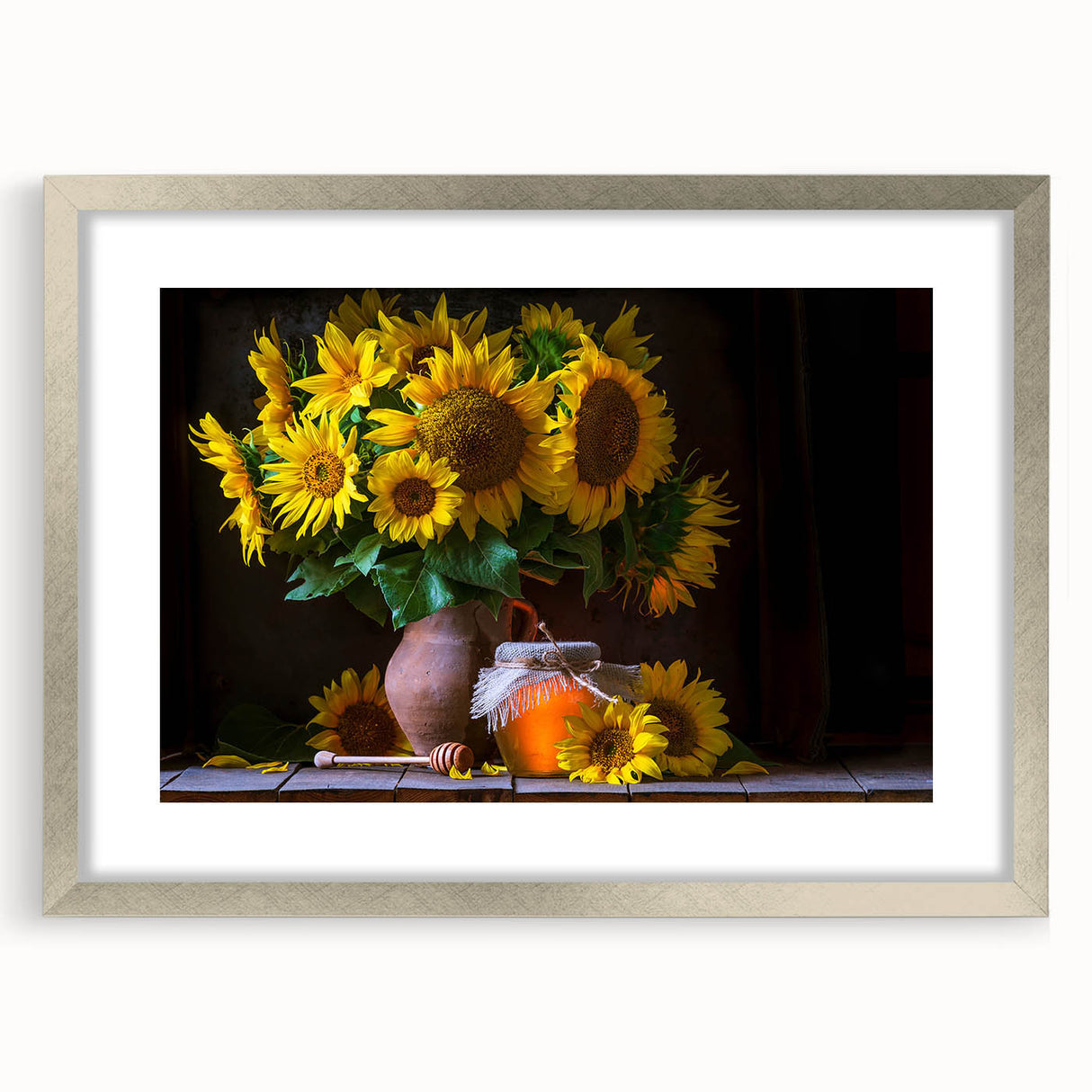 Framed botanical wall art featuring a vibrant sunflower design with a silver mat, ideal for home decor or as a gift for nature lovers.